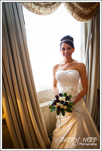 Window pose at Brandshatch Place Hotel in Kent - Wedding Photography