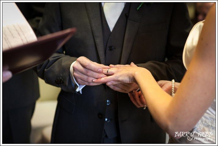 The exchange of rings at Brandshatch Place Hotel in Kent - Wedding Photography