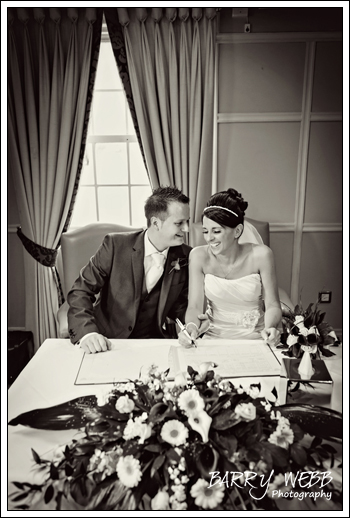 Signing the register at Brandshatch Place Hotel in Kent - Wedding Photography