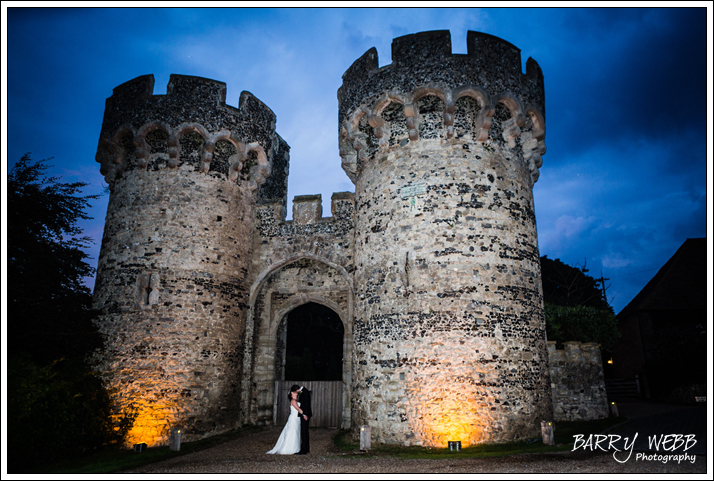 The Bride and Groom at the entrance of Cooling Castle Barn