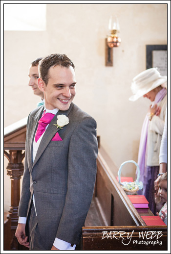The groom sees his bride at Waltham Church in Kent