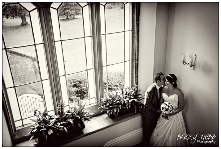 A kiss on the stairs at Oakwood House
