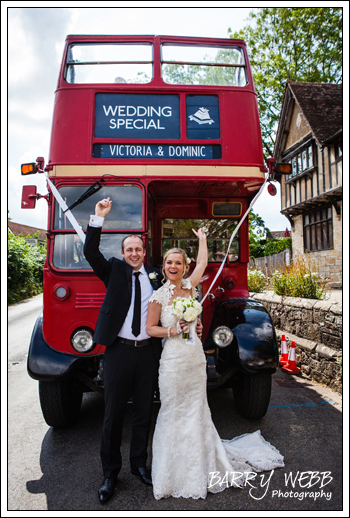 The Bride and Groom infront of the Wedding Bus
