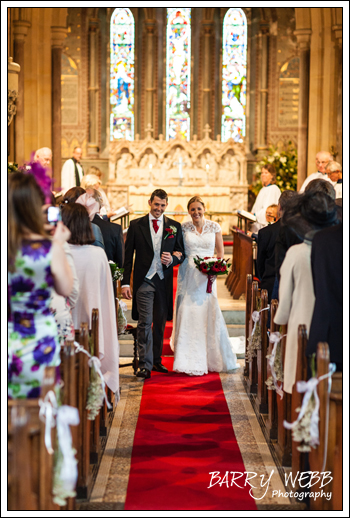 Walking up the aisle - Wedding at St Giles' Church in Shipboourne
