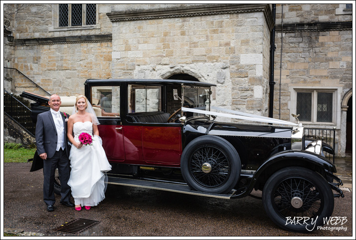 The Bride and her Father pose infront of a beautiful classic car - Wedding at Archbishops Palace in Maidstone, Kent