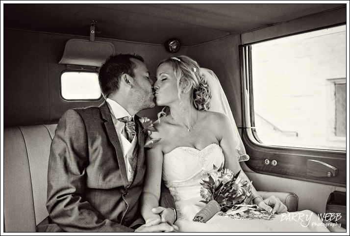 A kiss in the car - Wedding at Archbishops Palace in Maidstone, Kent